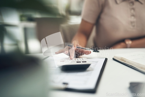 Image of Accountant, finance and business woman calculating a budget or expense in her office. Closeup of a financial advisor planning tax payment, savings or investment for a company using a calculator