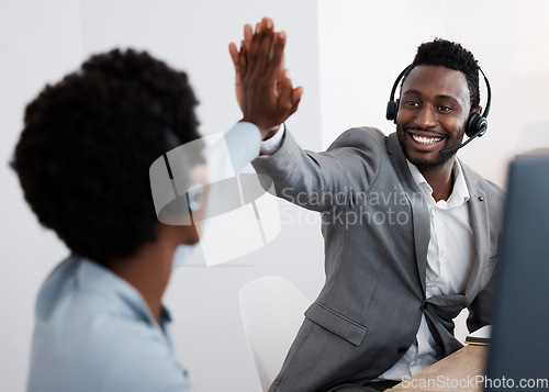 Image of High five, congratulations and success with support staff or customer service personnel working together in a call center. Closing a deal, making a sale solving a problem to help and assist online