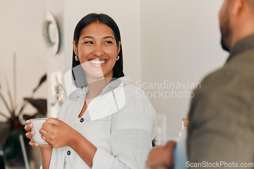 Image of Woman drinking coffee, having conversation and bonding with her husband at home. Smiling, happy and relaxed wife enjoying quality time, romantic and peaceful moment as a couple in loving relationship