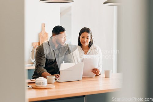 Image of Planning home loan couple with laptop looking at budget, bills or finance paper work confused by the expenses, budget or mortgage. Married man and woman managing utility document or debt online