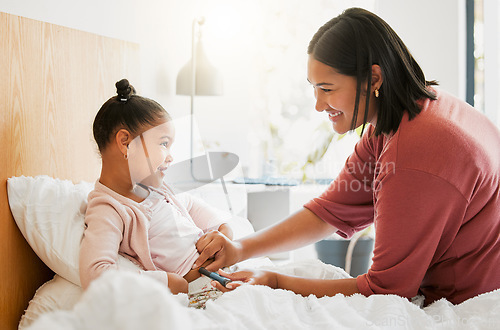 Image of Diabetes, insulin and diabetic happy girl getting injected by her mom in her bedroom for their morning routine at home. Family, mom and kid smiling, medicating and using a finger stick for blood test