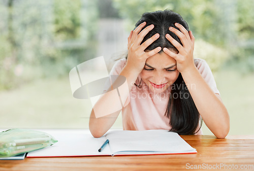 Image of Stress, anxiety and overwhelmed with a little girl struggling with her studies, education and learning at home. Confused, frustrated and tired student having trouble with homework and study material