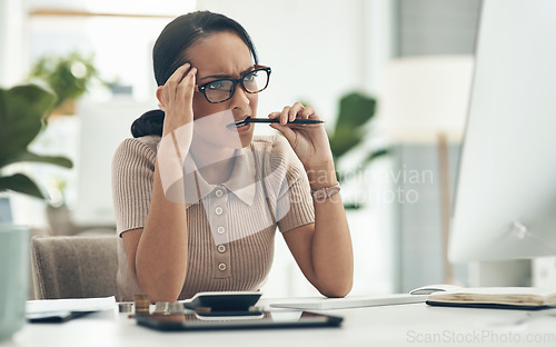 Image of Confused, stress and frustrated worried financial planner, accountant upset and worried budget at work with a computer, notebook and plan form. Anxious female with finance, money problems and issue