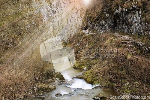 Image of river flowing into a limestone creek