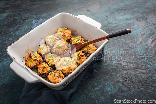 Image of Oven baked stuffed mushrooms - champignons with cream cheese and dried tomatoes in casserole