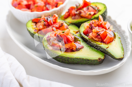 Image of Avocados filled with bruschetta and balsamic vinaigrette - vegan appetizers