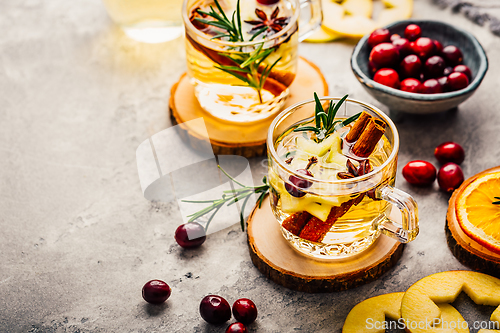 Image of Delicious white mulled wine with apples, cranberries and spices