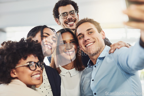 Image of Fun, united colleagues taking a selfie with a phone looking excited, happy or motivated and ready to take startup business to the top. Smiling, happy and cheerful office group or team together