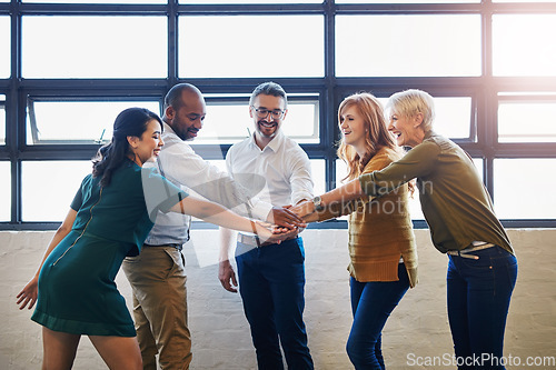 Image of Teamwork, fun and collaboration by diverse team joining hands in team building. Excited group linking, joining and supporting goal, mission or vision at work. Trust by professional creative coworkers