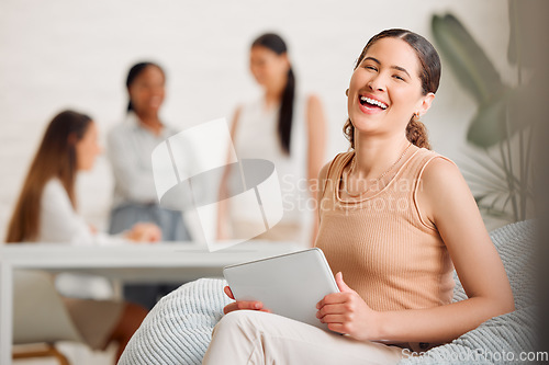 Image of Businesswoman, team leader or manager on a tablet working at a female only company or women empowerment workplace with colleagues in background. Corporate professional with business success portrait