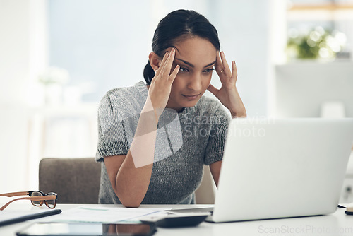 Image of Confused, stressed and anxious businesswoman with laptop suffering from a headache, pressure and agency deadline. Creative entrepreneur thinking of solution, making mistake and trying to understand