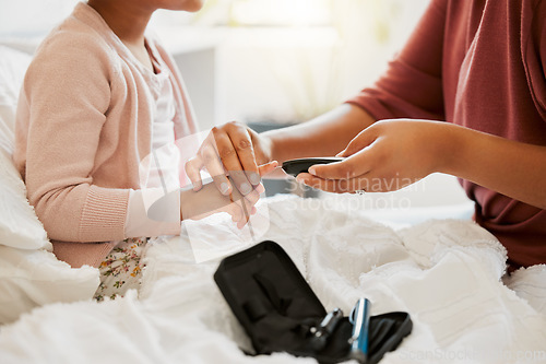 Image of Needle, finger monitor and blood testing by medical care professional at home or hospital appointment. Pathology, healthcare and nurse consulting patient with diabetes or at risk of illness.