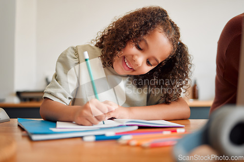 Image of Learning, smiling and creative young girl drawing with a colorful pencil feeling happy and content. Positive student with a smile having a fun time creating artistic art in her kids notebook at home