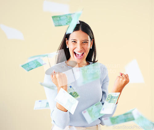 Image of . Celebrating money, finance and investment growth or savings, wealth or budget development. Portrait of excited, cheering female millionaire with floating bank cash and currency after lottery win.