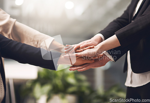 Image of Hands, unity and support in the business office while motivating each other showing support and togetherness. Team of businesspeople in a circle and celebrating their success together at work