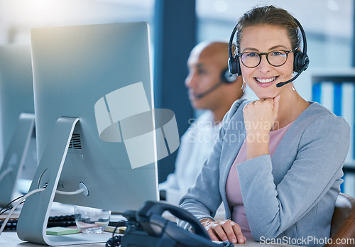 Image of Call center agent, telemarketing employee or customer service worker is happy and smiling in the office. Portrait of a caucasian female sales representative ready and excited to help and answer calls