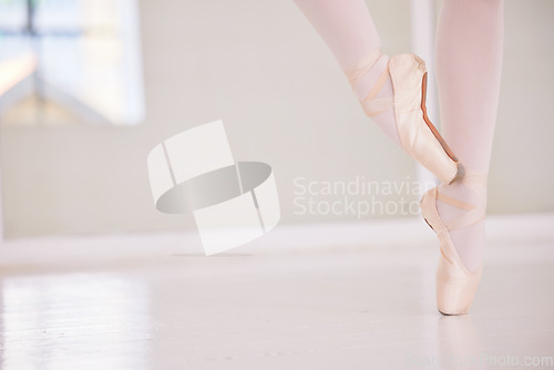 Image of Ballet feet or legs on the tiptoe dancing or practicing in a dance studio or class with copy space. Closeup of an elegant dancer or ballerina in pointe shoes preparing for a performance