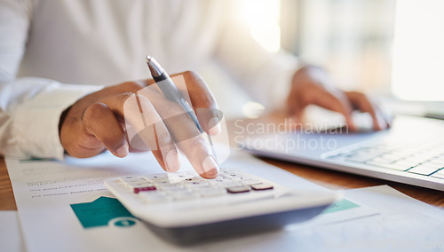 Image of Finance, accounting and fintech, a man on a computer and calculator working out his business budget strategy. Businessman at his office desk, laptop, money management and financial investment online.