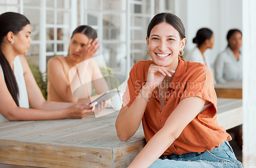 Image of Smiling, happy and motivated female entrepreneur attending a meeting with a positive mindset in creative office. Portrait of confident and proud entrepreneur satisfied with job in a startup business