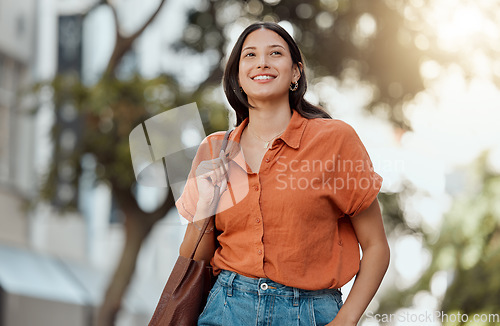 Image of Stylish, happy and trendy student walking in a city, commuting to a college and enjoying a weekend break downtown. Smiling, edgy or funky woman exploring, visiting and enjoying town while sightseeing