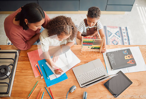 Image of Learning, education and family doing homework with girl child writing in her book during homeschooling lesson with her mother from above. Student, development and studying during quarantine at home