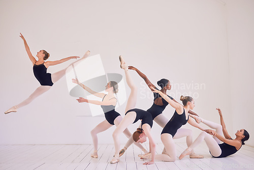 Image of Group of contemporary or ballet dancers performing a unique sequence in a studio. Team of modern elegant ballerinas dancing or practicing for performance and creating entertainment art