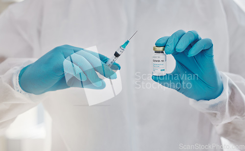 Image of Health care, science and innovation by a doctor holding a vaccine for corona or injection for virus with copy space. Medical discovery by a researcher leading a drug trial on a treatment for covid