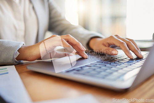 Image of Keyboard, laptop and typing closeup of worker at desk in office. Business employee reading emails on computer in corporate company. Woman working with wireless digital technology to use the internet.