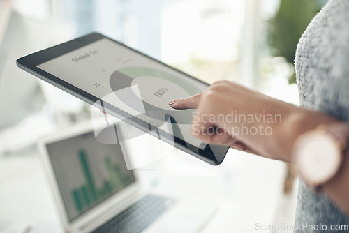 Image of Businesswoman, investor or financial analyst analyzing business profit, data and strategy on tablet. Female banker, manager or freelancer working on statistic graph standing in an office.