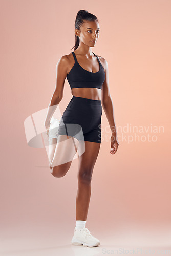 Image of Fitness, exercise and workout athlete stretching out her legs before training indoors to stay healthy and young. Active, body and sporty woman warms up strong muscles for her motivated lifestyle