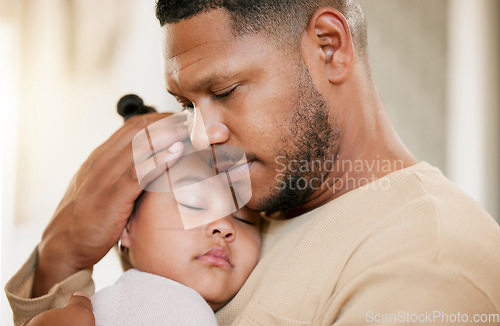 Image of Father carrying his sleeping daughter, hugging and bonding with affection at home. Caring parent enjoying fatherhood, holding his girl child, enjoying quiet moment of care, consoling and safety