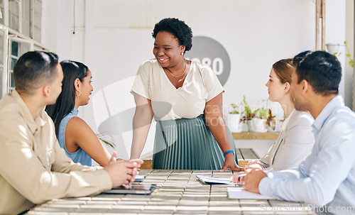 Image of Female leader talking in team meeting, collaboration and planning for a business or company project. A group of social media content writers discussing, thinking and coming up with new ideas