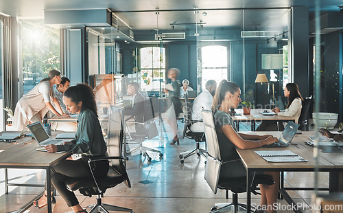 Image of Corporate business people working in busy marketing office space, planning strategy in books and reading email on laptop at work. Businessman, businesswoman and workers at startup advertising company