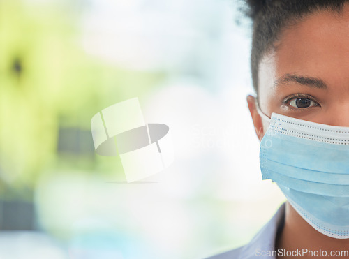 Image of Humanity, care and protection person in covid mask with half face pose on bokeh or blurred healthcare background. Hygiene woman covering face to stop the spread of virus or disease