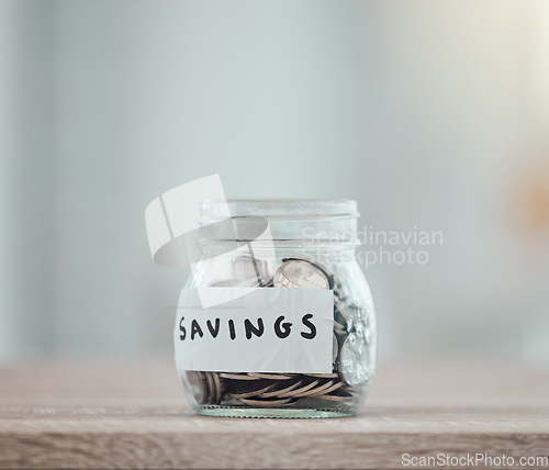 Image of Savings, money and finance with many silver coins in a jar for retirement, banking and investment growth. Start to save for college, pension or wealth with financial freedom from saved income