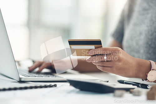 Image of Banking, payment and paying bills online with ebanking on a laptop with a credit or debit card. Closeup of a woman doing online shopping during inflation. Female making payment for debt and mortgage.