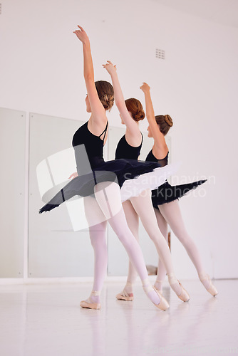 Image of Ballet dancers dancing and practicing in a dance studio together preparing for a performance. Group of elegant, skilled and talented ballerinas moving in sync and learning in a class or club
