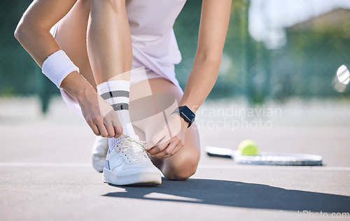 Image of Female tennis player foot and hands tying shoelaces before game match on outdoor sports court. Active, sporty woman preparing for training for fun, summer exercise and healthy, wellness lifestyle.