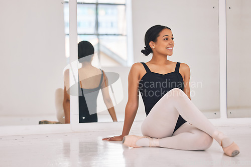 Image of Ballet, ballerina and dancer sitting on floor during break and rest from dancing beautiful, elegant or classical choreography. Smiling professional performer in dance studio after practicing routine