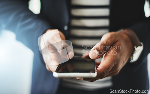 Image of Hands of business man typing on phone, networking on social media and browsing internet at work. Closeup of a professional corporate employee checking a text, scrolling an app and reading message