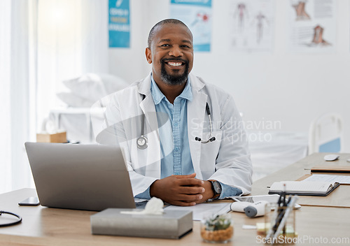 Image of Doctor, medical healthcare worker and male physician at hospital or clinic working with stethoscope and electronics. GP man on laptop reading emails, patient records and documents in covid pandemic