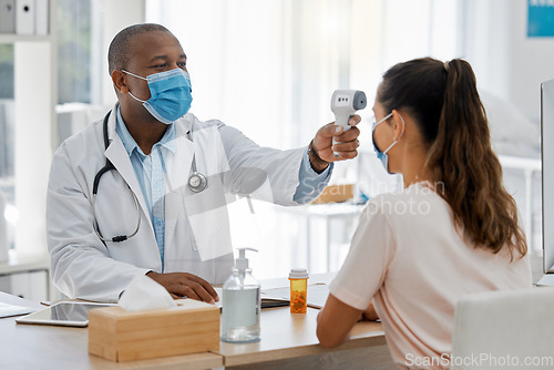 Image of Temperature, covid thermometer and forehead fever check by doctor, medical professional and consulting healthcare worker. Sick or ill female patient with mask in clinic, hospital and health center