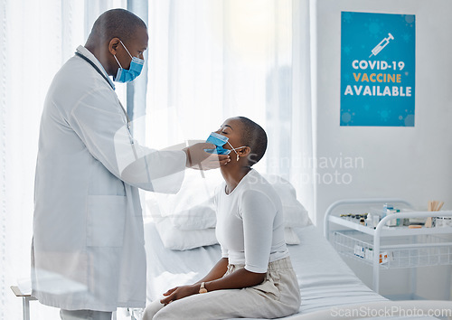 Image of Doctor with patient in covid face mask doing examination of thyroid or throat disease during medical checkup, visit or appointment. Insurance healthcare worker checking woman for swelling or covid 19