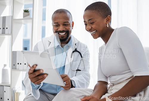 Image of Doctor, healthcare and medicine with a patient talking test results and progress on a tablet in a hospital clinic. Trust, help and medical consulting with a professional medicare worker in his office