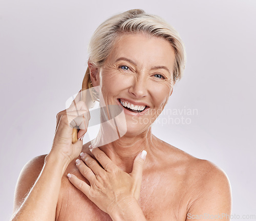 Image of Grooming, hygiene and hair care for a mature woman brush and style grey hair, smiling and happy. Portrait of a senior female enjoying selfcare and treatment, pamper session against pink background