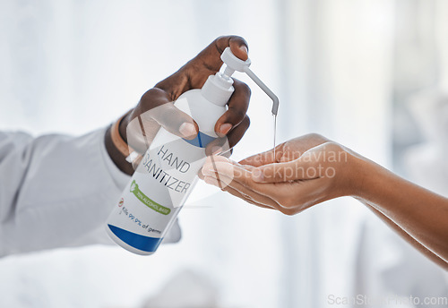 Image of Doctor apply hand sanitizer cleaning, hygiene and covid procedures during quarantine. Medical, healthcare and safety professional disinfecting their hands to protect from corona virus or covid19