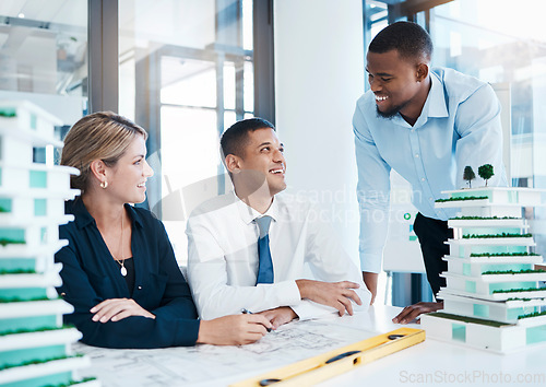 Image of Architecture, interior and architect engineers with blueprint model and a floor plan planning together. Happy building designers working in collaboration on engineering project in an office meeting