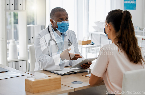 Image of Doctors office, masks and sick patient consulting healthcare medic for covid virus test results at a hospital desk. Life insurance, people and medical employee giving woman support, help and service