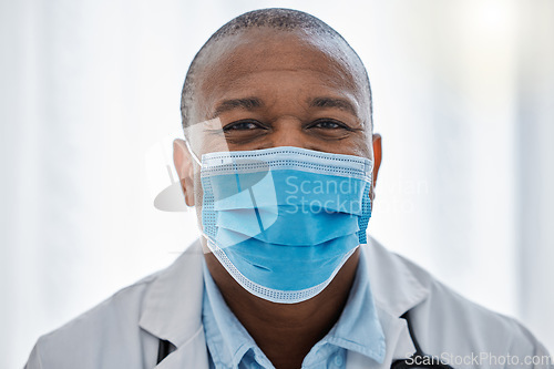 Image of Covid doctor wearing face mask for safety, protection and hygiene while working in a medical hospital or clinic. Portrait of trusted male physician, healthcare expert and frontline worker in pandemic