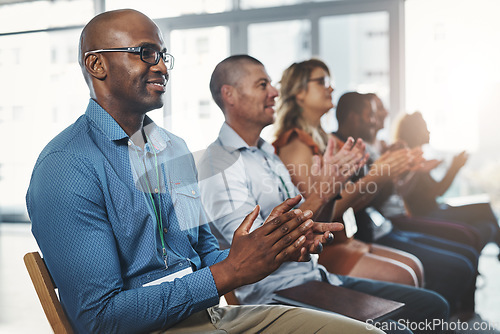 Image of Employees sitting and clapping together in a seminar and successful workshop. Diverse workplace that support the staff with a training conference. Celebrating professional relationships in business.